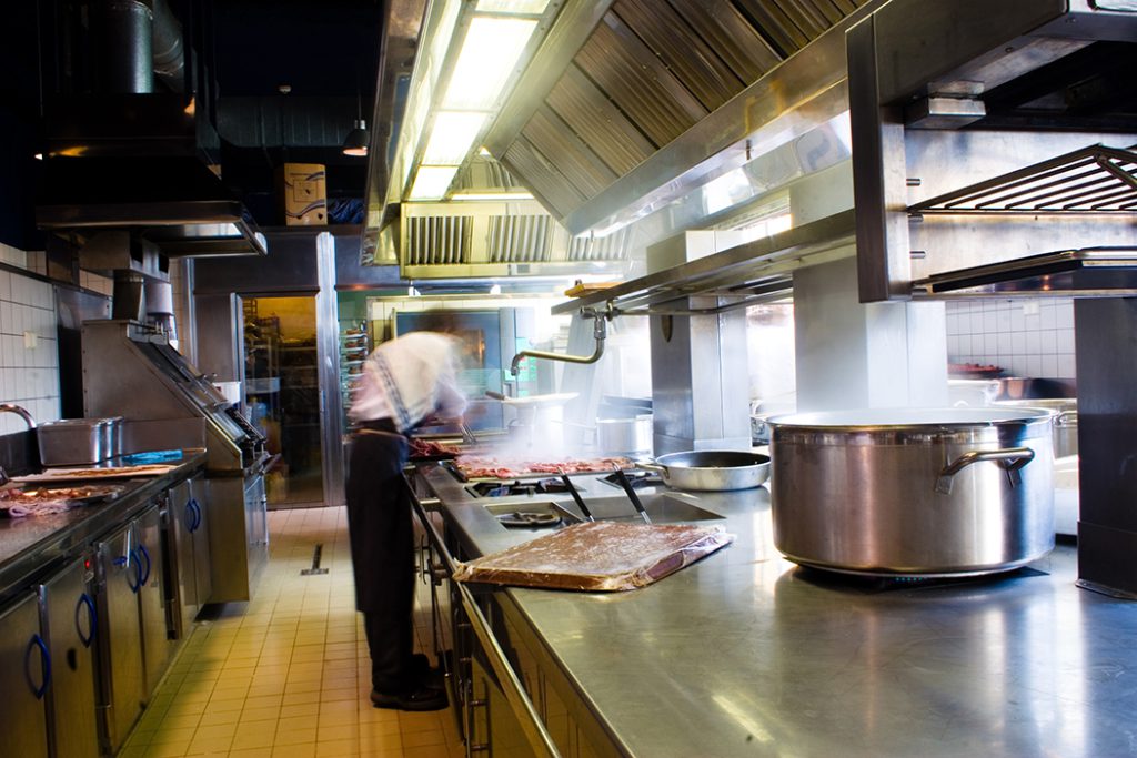 Commercial kitchen with steam from food